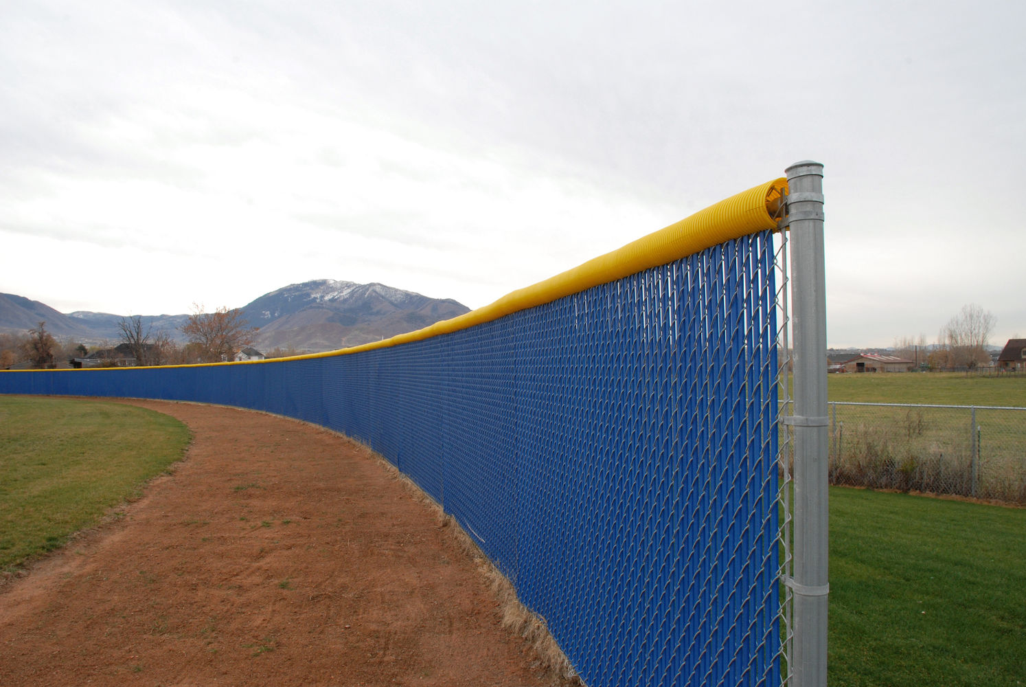 Blue Outfield Fence with Yellow top cap